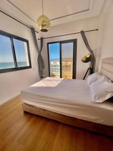 Ένα ή περισσότερα κρεβάτια σε δωμάτιο στο Baya House Sea View