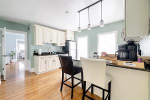 a kitchen with two chairs and a counter top at Bright Spacious Apartment - 2 BR 2 BA in Portland