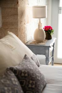 เตียงในห้องที่ Montegrappa Dimore e Suite Alberobello
