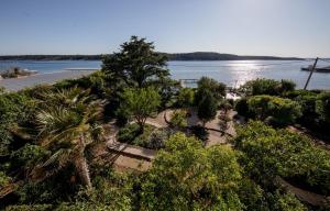 an aerial view of a park with trees and water at Apartments and rooms by the sea Barbat, Rab - 20049 in Rab