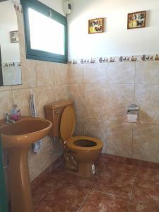 a bathroom with a toilet and a sink at Finca San Francisco y San Javier (ex Finca los tres changos) in Salta