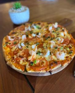 a pizza sitting on top of a table at The Commercial Hotel Wallerawang in Wallerawang