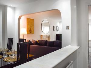 a living room with a couch and a table at West Street House in Southport