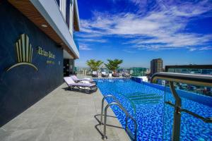 a swimming pool on the roof of a building at URBAN PALACE in Phnom Penh