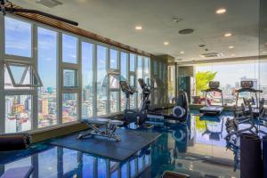 a gym with a view of a city at URBAN PALACE in Phnom Penh