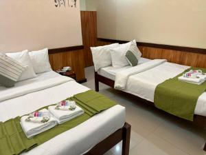 Postel nebo postele na pokoji v ubytování Desert Rose Beach Hotel