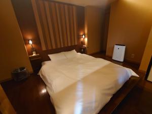 Letto o letti in una camera di Hotel Forest