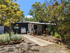 an image of a house with a garden at Tiny House 12 at Grampians Edge in Dadswells Bridge