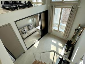 an overhead view of a living room with a mirror at Near DMC, Fully furnished, Loft sturcture, New APT in Goyang