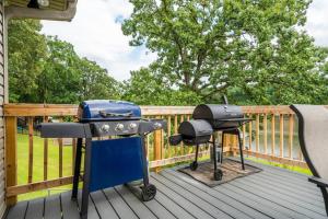 a grill and a smoker on a deck at Lake Livin' in Hot Springs