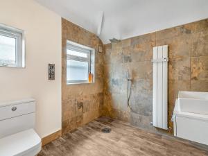 a bathroom with a sink and a toilet at Gateway Retreat in Barrowford