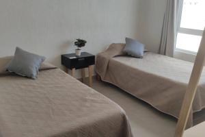 Postel nebo postele na pokoji v ubytování Cancun Departamento Luna