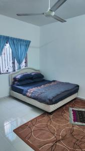 a bed sitting on the floor in a bedroom at Eing's Homestay - Muslim And Mahram Only in Kajang