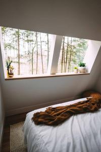 Postel nebo postele na pokoji v ubytování Dunlap Hollow A-Frame
