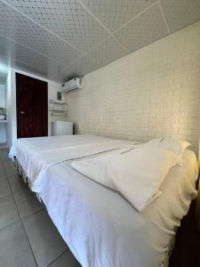 Postel nebo postele na pokoji v ubytování Suite para parejas