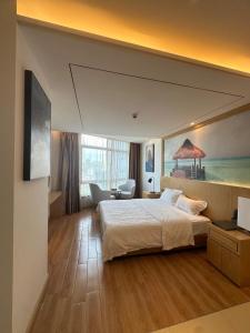 Säng eller sängar i ett rum på 海龙宫度假酒店