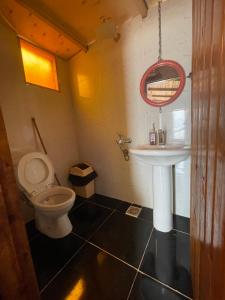 a bathroom with a toilet and a sink at Live the bedouinlife in Nuweiba