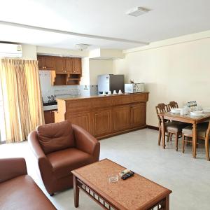 a living room with a couch and a table at Omni Suites 2Bedroom in Bangkok
