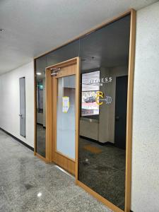 an entrance to an office building with a glass door at Near DMC, Fully furnished, Loft sturcture, New APT in Goyang