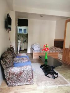 a living room with a couch and a table at newa home in Pātan