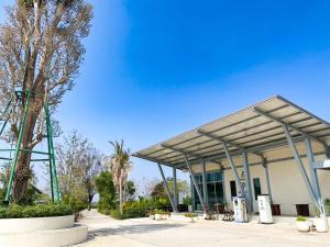 a building with a canopy in front of it at At Pream&Chan resort แอท เปรมแอนด์จันทร์ รีสอร์ท in Ban Krasang
