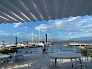 a man standing next to a marina with boats at Casa Zanelli, lugar de paz… in Baní