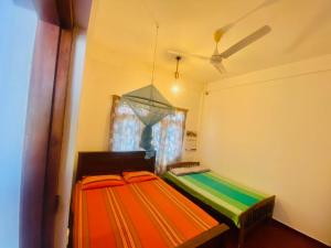 Ένα ή περισσότερα κρεβάτια σε δωμάτιο στο Hamba Hostel for Safari