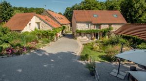 an overhead view of a house with a garden at Domaine de la Jarrige in Saint-Vaury
