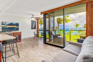 a living room with a couch and a table at KIHEI SURFSIDE, #512 condo in Wailea