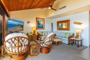 a living room with a couch and chairs at MAKENA SURF, #E-303 condo in Wailea