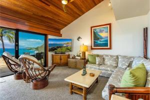 a living room with a couch and a table at MAKENA SURF, #E-303 condo in Wailea
