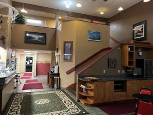 a room with a staircase in the middle of a room at Americas Best Value Inn Kalispell in Kalispell