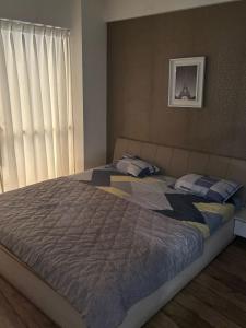 Un pat sau paturi într-o cameră la Rajhans Belizia JSM
