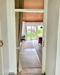 a hallway with a door leading to a dining room at Ferienhaus Seeblick in Breitenbrunn