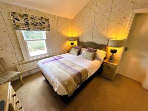 Ein Bett oder Betten in einem Zimmer der Unterkunft Ravenstone Lodge Country House Hotel