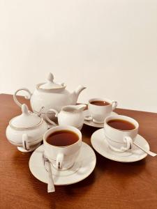 a group of cups of coffee on a table at The Kandyan Secret Villa - Free Pick up From Kandy Railway Station in Kandy