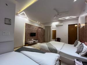 Hotel Shree Darshnam客房内的一张或多张床位