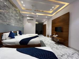 Hotel Shree Darshnam客房内的一张或多张床位