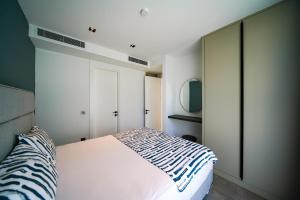 A bed or beds in a room at The Ni Villas Akyarlar - Bodrum