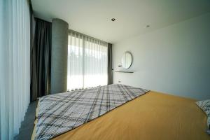 A bed or beds in a room at The Ni Villas Akyarlar - Bodrum