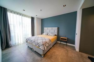 A bed or beds in a room at The Ni Villas Akyarlar - Bodrum