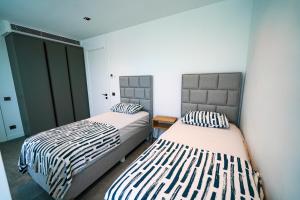 A bed or beds in a room at The Ni Villas Akyarlar - Bodrum Még 23 kép