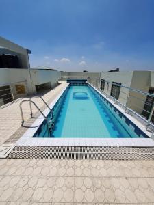 a swimming pool on top of a building at Lalucia in Nairobi