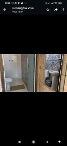 a picture of a bathroom with a sink and a toilet at Hospedagem do Marcão in Belo Horizonte