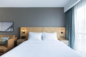 Postelja oz. postelje v sobi nastanitve Sandman Signature Dartmouth Hotel & Suites