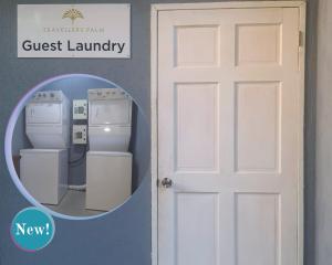 a white door next to a white washer and dryer at The Palms Resort in Saint James
