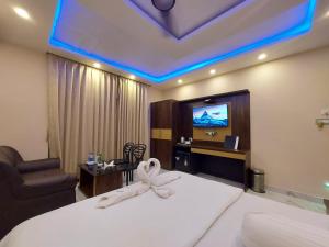 TV a/nebo společenská místnost v ubytování Balukona Beach Resort