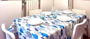 a dining room table with a blue and white table cloth at Da Elsa in Chioggia +9 photos