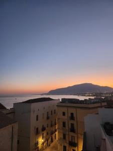 a view of a city with buildings and the ocean at Boutique Rooms and Breakfast GranVeliero in Trapani