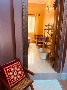 an open door to a room with a mirror at Binta Boutique Hotel in Nungwi